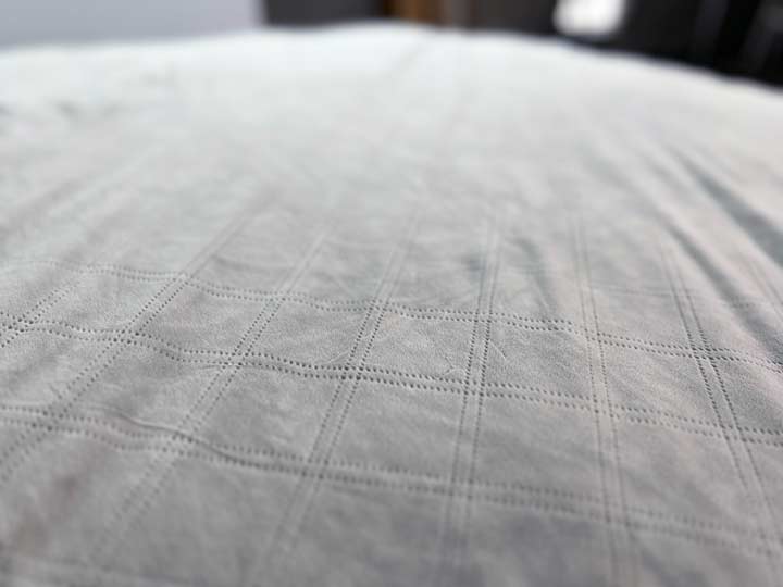 A close up shot of the Puffy Weighted Blanket, showing off its fuzzy minky texture.