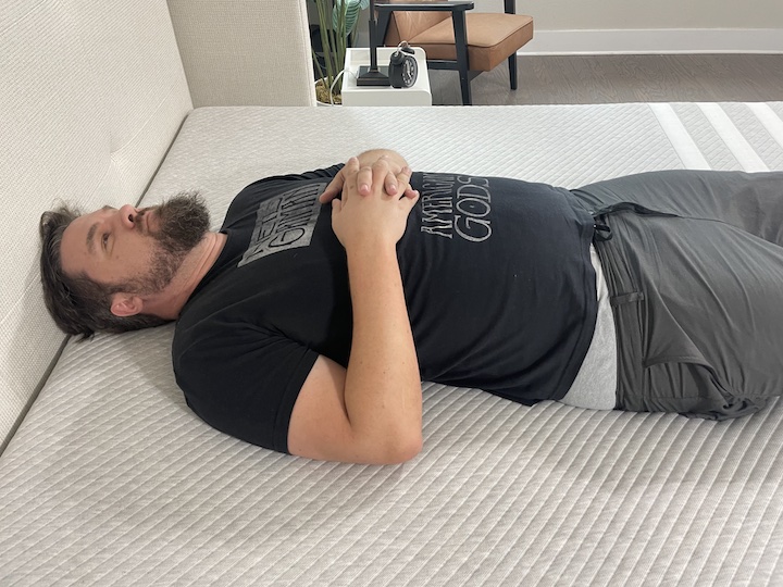 a man sleeps on his back on the Leesa Original Mattress