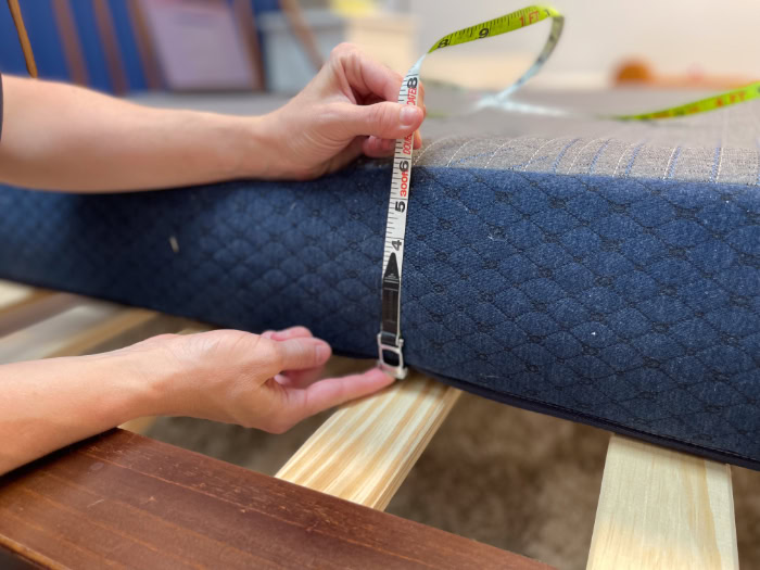 A tape measure shows the Brooklyn Bedding Kids mattress is 6 inches tall
