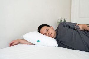 A man sleeping on the Marlow pillow