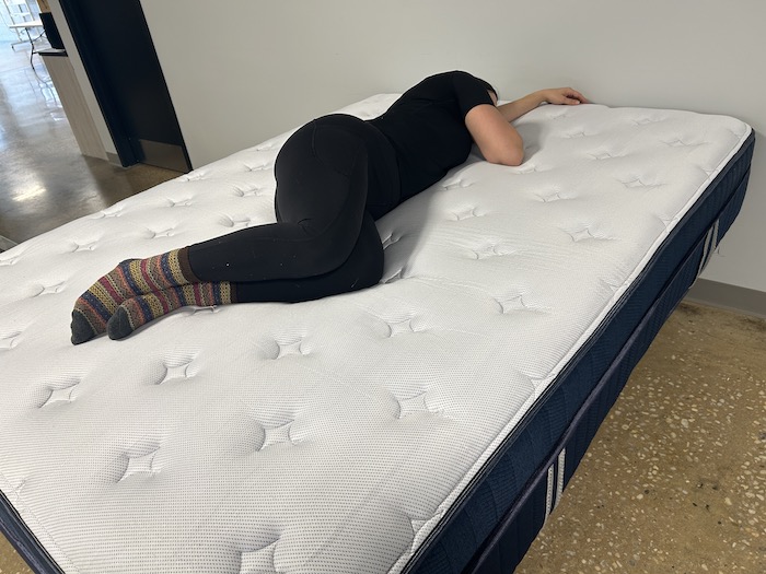 a woman lying on her side on the silk & snow hybrid