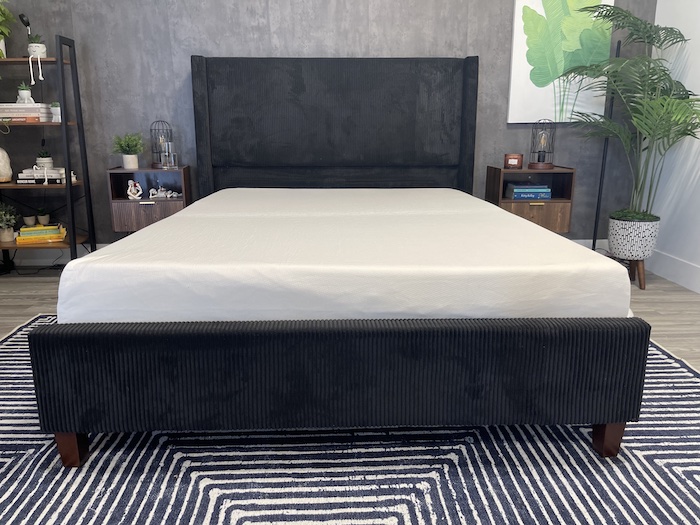 The Polysleep Sierra mattress on a black ridged bed frame