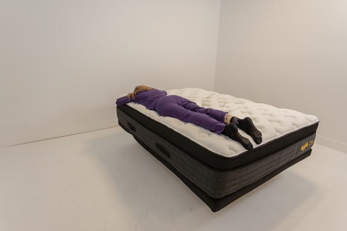 Our tester stomach-sleeping on the Nolah Evolution Mattress.