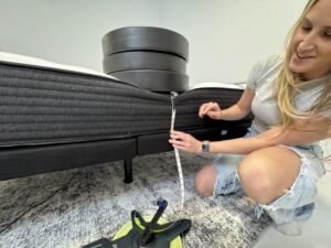 Measuring weight plates on the edge of a Plank Firm Mattress 3