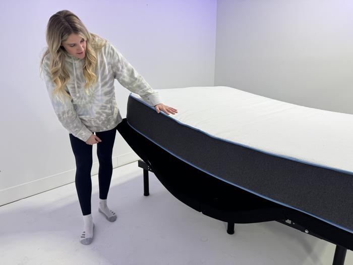 Our tester looks at a Bear Original Mattress on an adjustable bed