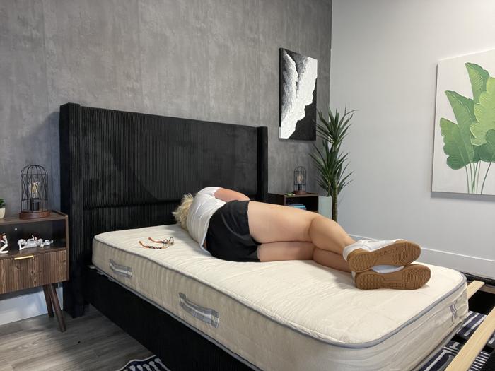 Our tester with the Nolah Nurture Kids Mattress