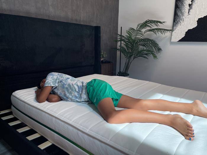 Our young tester stomach-sleeping on a Helix Kids Mattress