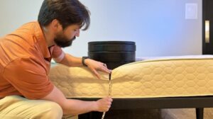 Measuring weight plates on the edge of the WinkBed EcoCloud Hybrid Mattress