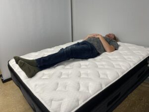 Our tester Back-sleeping on the Nolah Evolution Comfort Plus Mattress