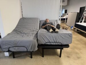 Front view of the DreamCloud Classic Adjustable Bed Frame with tester
