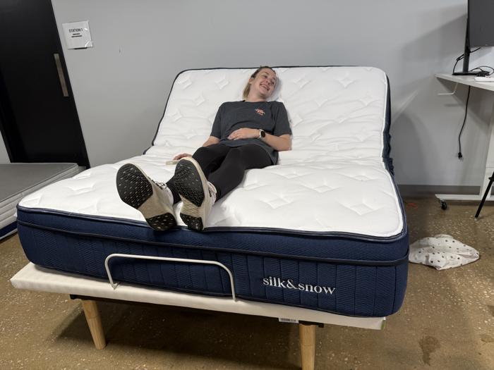 Full view of our product tester on the Silk And Snow Adjustable Bed Enhanced