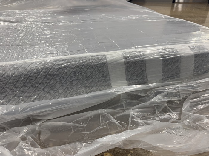 The Leesa Original mattress unboxed but still wrapped in plastic