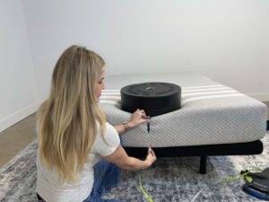 Measuring sinkage from placing weight plates on the edge of a Leesa Original Mattress