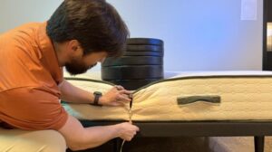 Measuring weight plates on the edge of the Avocado Green Mattress