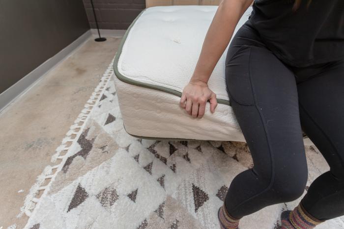 Seated edge-support test on the Avocado Green Mattress