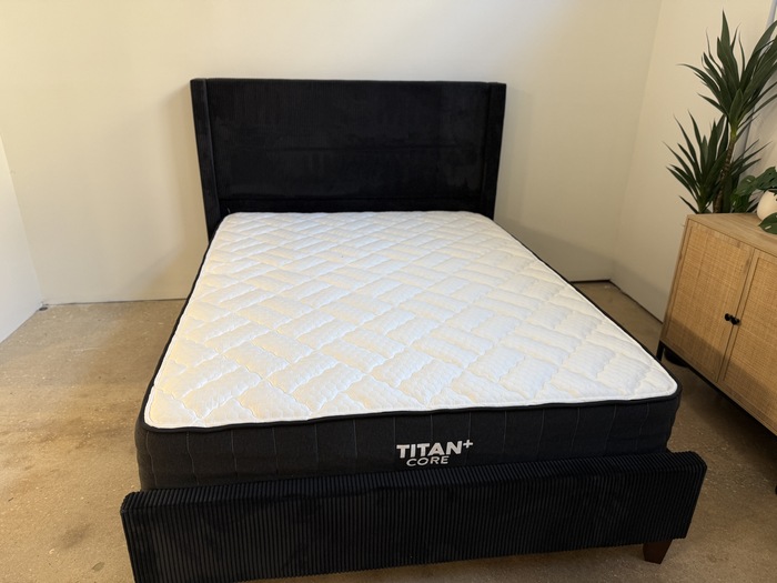 The Titan Plus Core mattress on a black bed frame