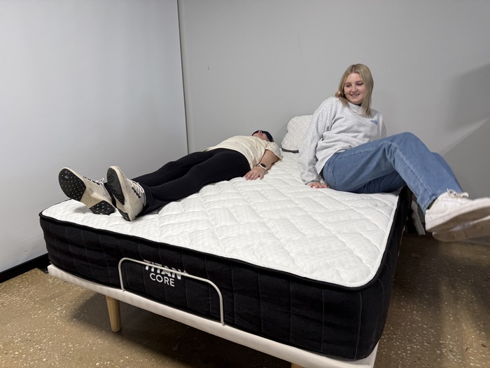 Testing motion isolation on the Titan Plus Core mattress by having two testers move around next to one another