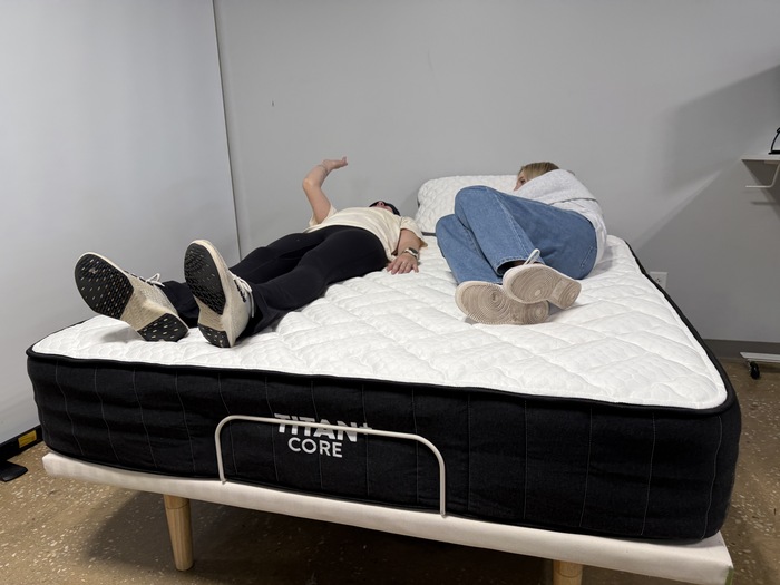 Testing motion isolation on the Titan Plus Core mattress by having two testers move around next to one another