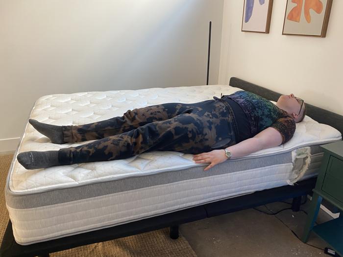 Our tester back-sleeping full body edge support test of the Helix Plus Mattress