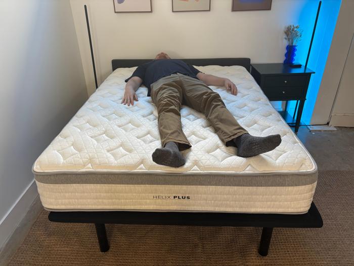 Our tester back-sleeping on the Helix Plus Mattress