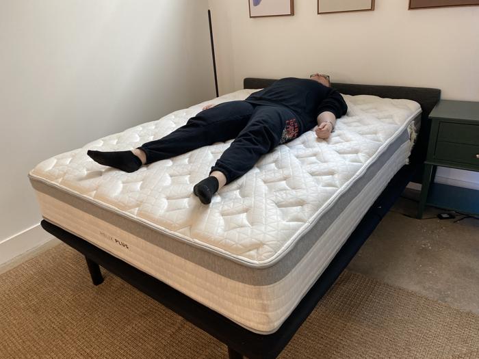 Our tester back-sleeping on the Helix Plus Mattress