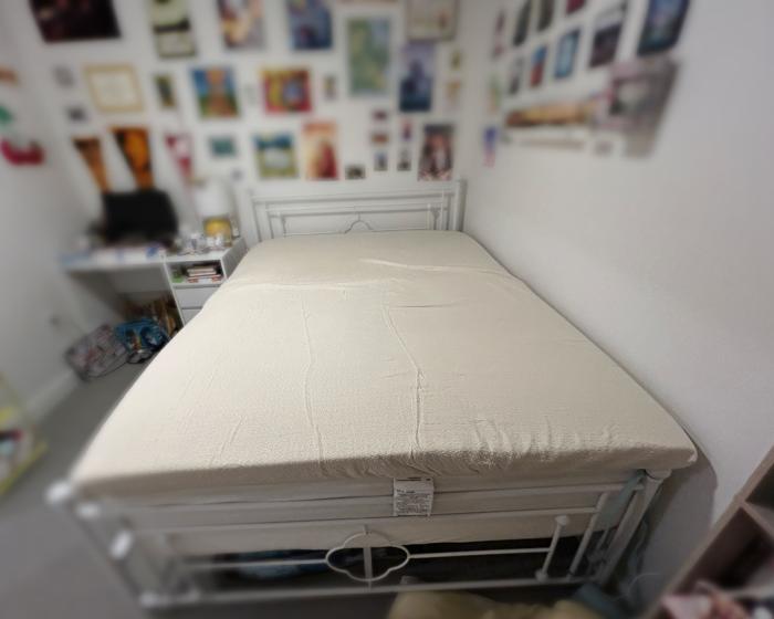 Avocado Organic Topper on a bed