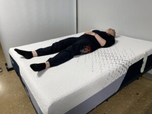 Our tester back-sleeping on the Nectar Premier Memory Foam